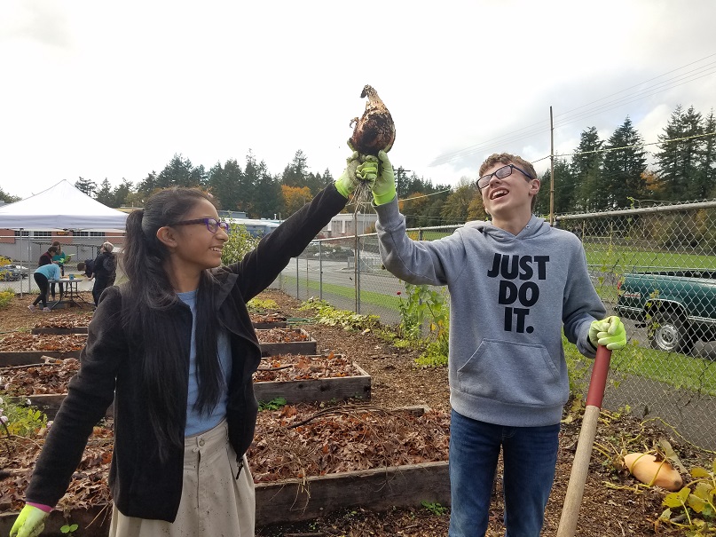 LCSG – Students are so proud of the beautiful produce they grow – a triumphant onion!